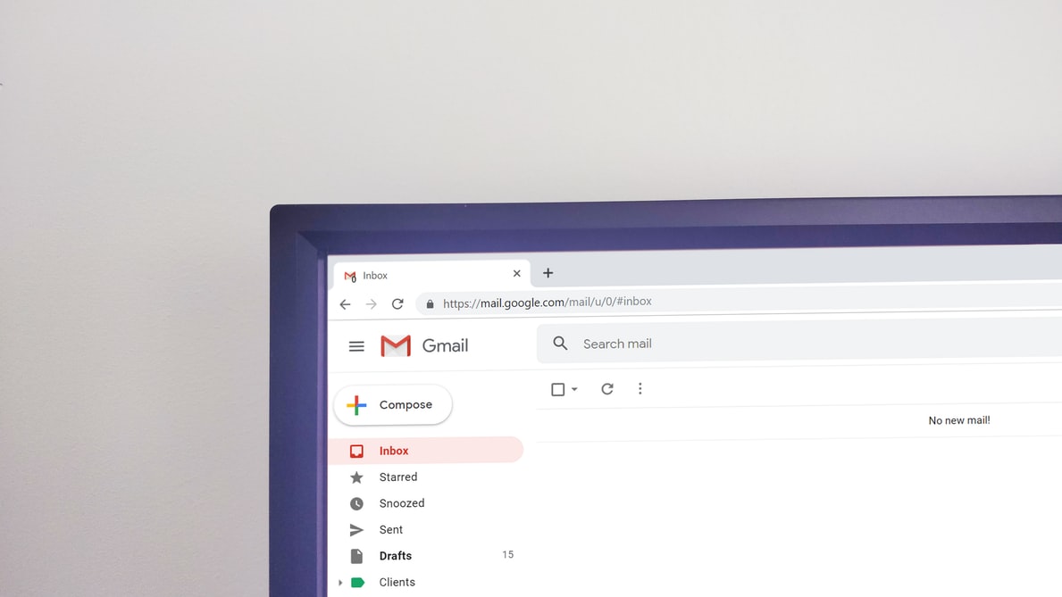 the top corner of a laptop screen with gmail on it